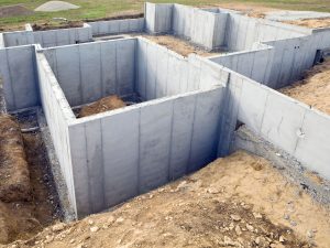 residential-construction-site-foundation-walls-184391602-58a5ccf85f9b58a3c9ad94bb